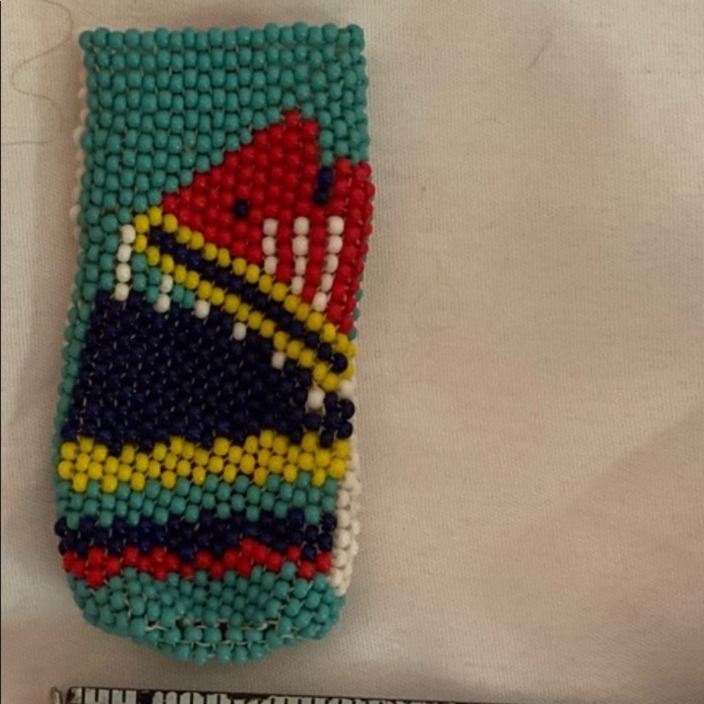 Hand beaded holder for a bic